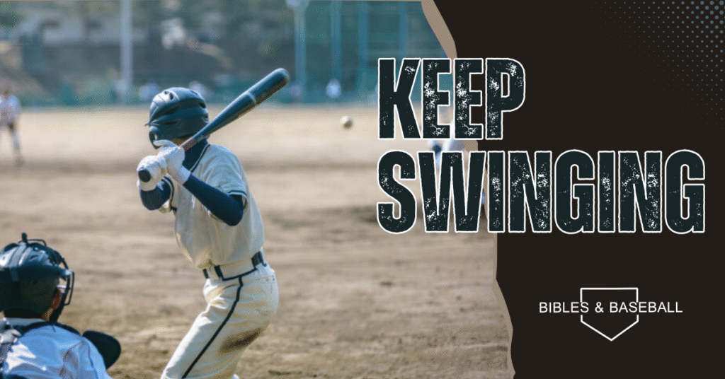 Baseball player at the plate watching a pitch approach with the words “Keep Swinging,” symbolizing perseverance, faith, and determination.