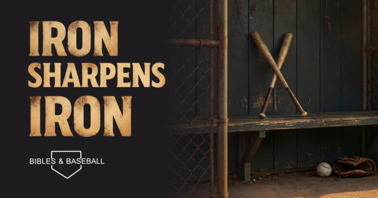 Crossed wooden baseball bats resting on a dugout bench with a glove and baseball on the dirt floor beneath the headline “Iron Sharpens Iron” from Proverbs 27:17.