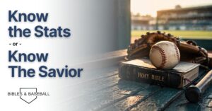 Baseball resting on a Holy Bible in a dugout with glove and bat in warm evening light